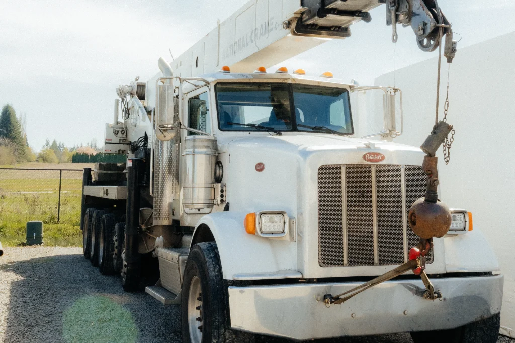 A Westmore Construction 55-ton crane truck ready for heavy lifting and industrial building projects in Vancouver, WA.