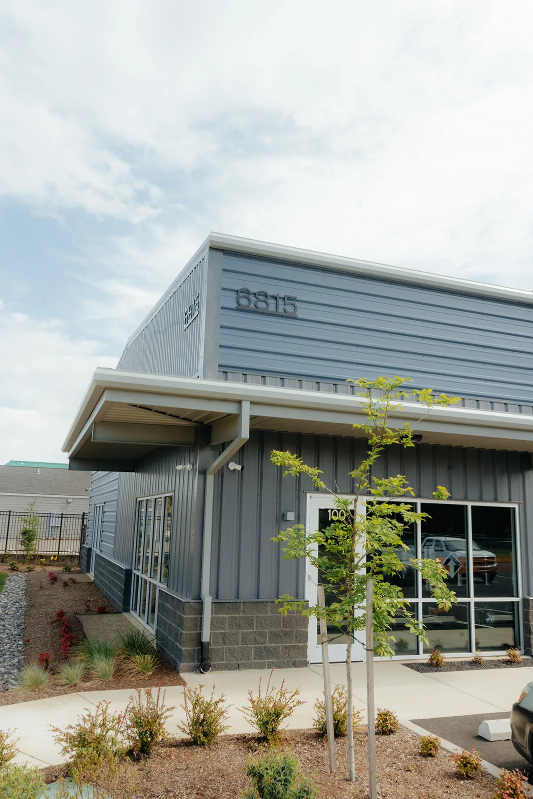 Completed gray metal commercial building erected by Westmore Construction