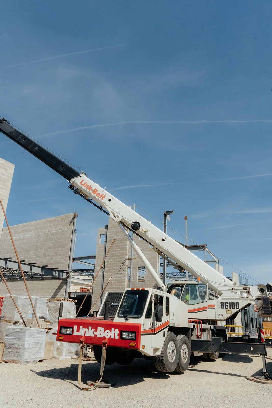Westmore Link-Belt crane with the boom raised at a commercial jobsite