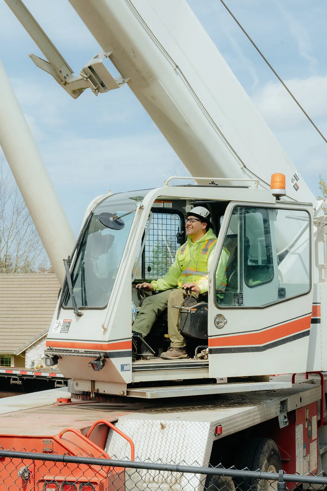 Westmore crane operator seated in the Link-Belt cab with the door open
