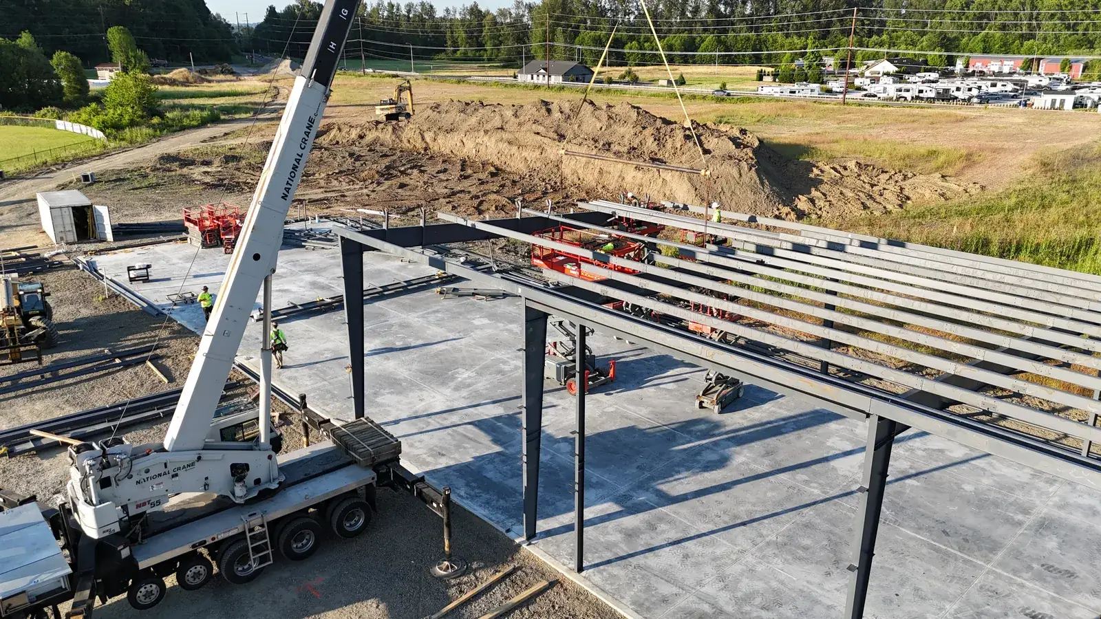Aerial view of a Westmore National Crane setting purlins on a pre-engineered steel frame