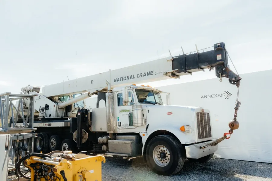 Westmore National Crane boom truck at the AnnexAir facility, boom raised