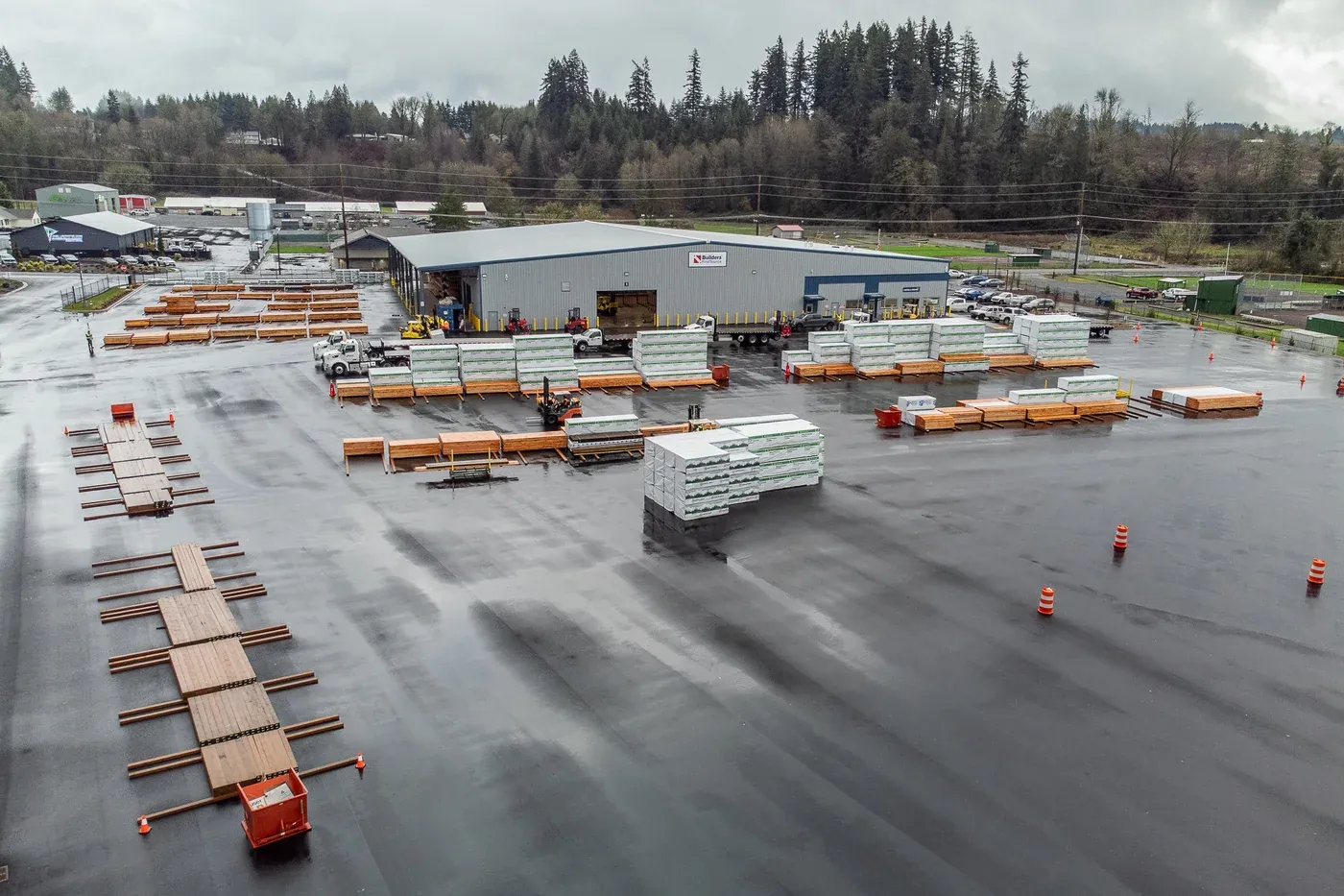 Aerial view of the Builders FirstSource steel building and lumber yard
